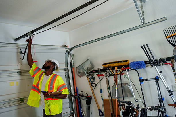 Professional Garage Door Panel Replacement technician working in West Slope, OR